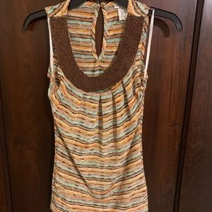 Sleeveless top with beaded neckline